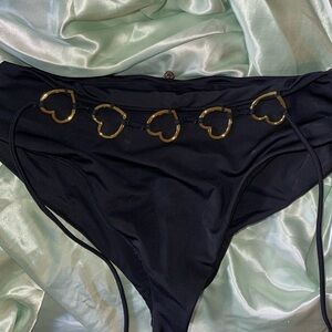 High-waisted black bikini bottoms with gold heart detailing